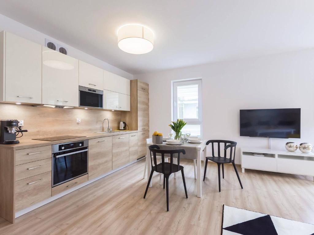 Kuchyň nebo kuchyňský kout v ubytování VacationClub - Solna Apartment C103
