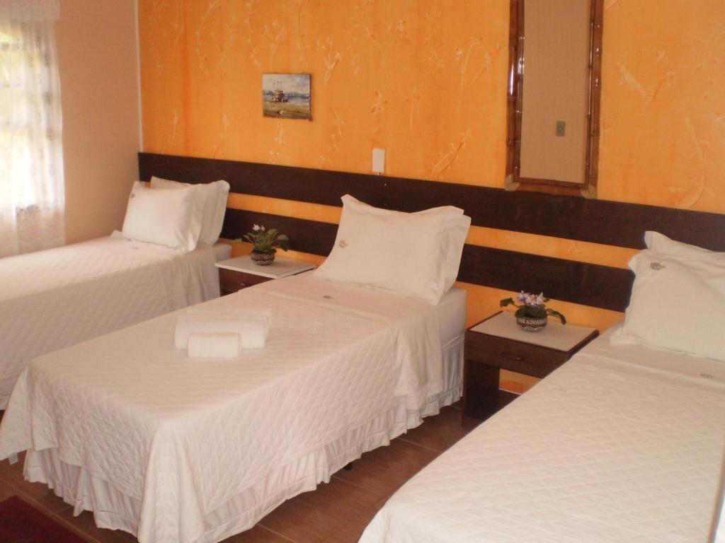 Cama ou camas em um quarto em Pousada Estrela do Mar