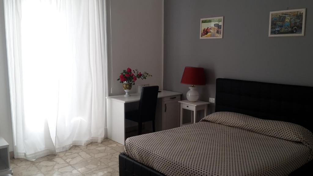 Postel nebo postele na pokoji v ubytování Gualtiero Camere & Suite