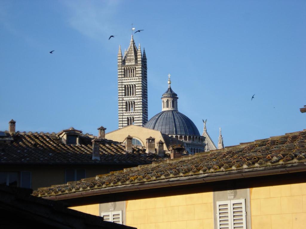 a view of the cathedral from the roofs of buildings at La Casa di Antonella in Siena