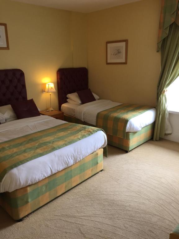 Postel nebo postele na pokoji v ubytování Faythe Guesthouse