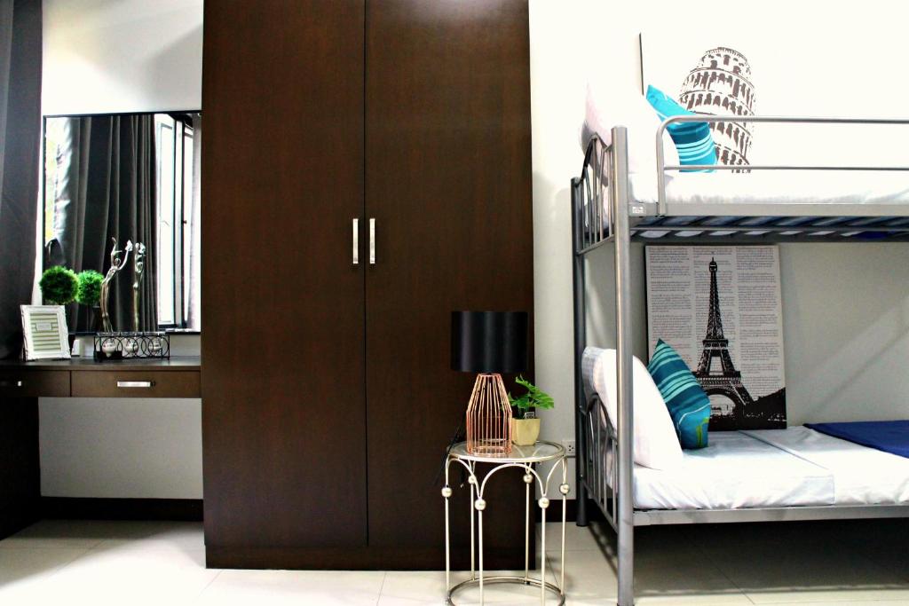 Postel nebo postele na pokoji v ubytování Ortigas Budget Hotel - Kapitolyo