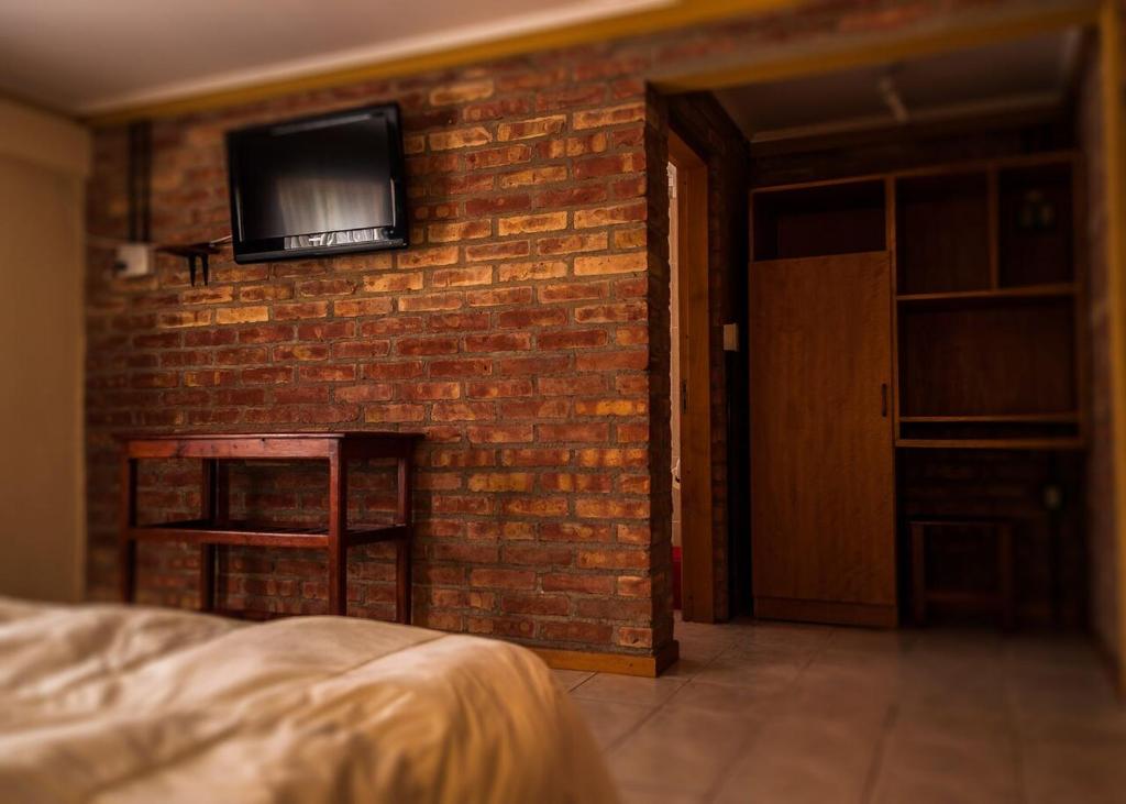 TV a/nebo společenská místnost v ubytování Calafate Hostel