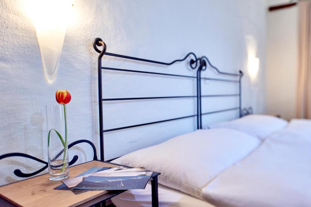 Postel nebo postele na pokoji v ubytování Hotel Restaurant Rathaus