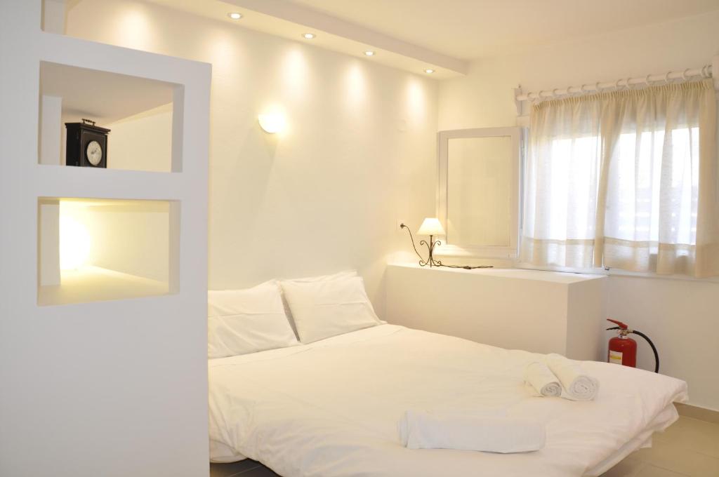 Postel nebo postele na pokoji v ubytování Ava Apartments