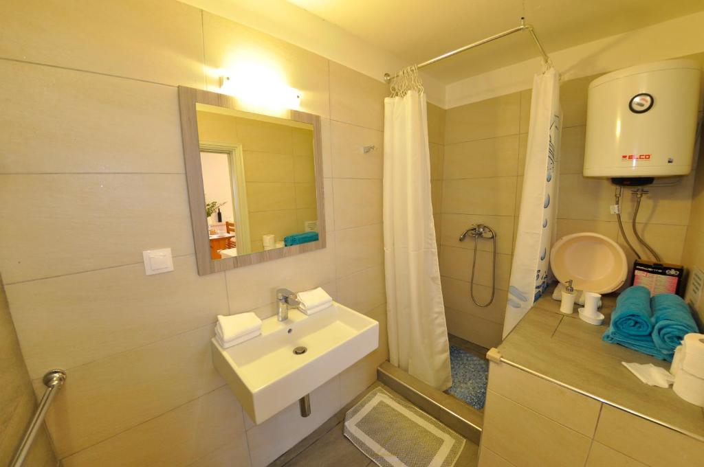 Koupelna v ubytování Ava Apartments