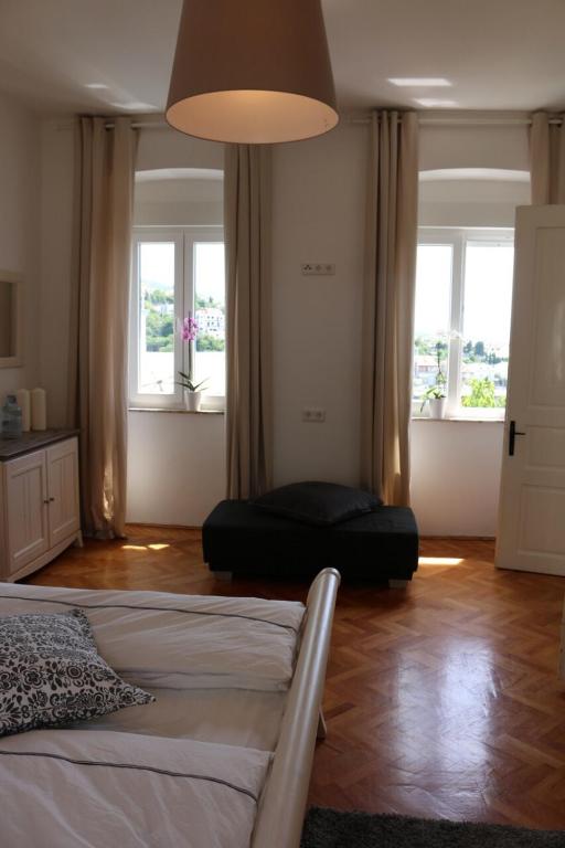 Postel nebo postele na pokoji v ubytování Central House Nona