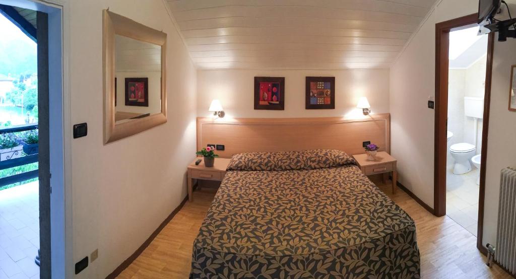 Postel nebo postele na pokoji v ubytování Hotel Monte Cimone