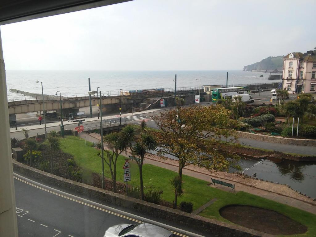 a view of the ocean from a building at Dawlish Sea View Apartment in Dawlish
