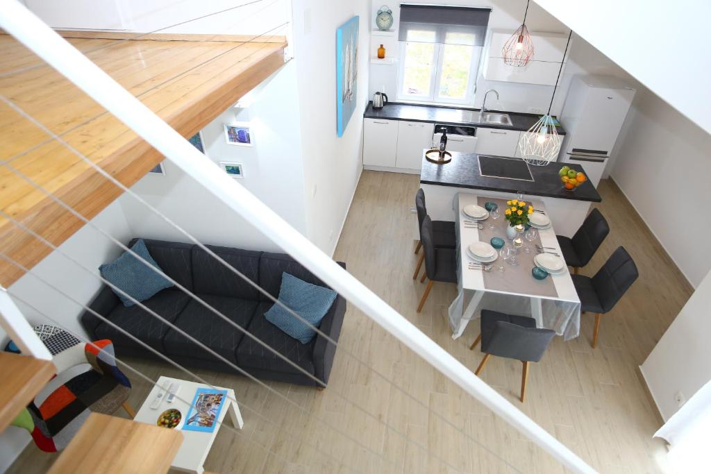 an overhead view of a kitchen with a table and chairs at Apartment Nikolina in Split
