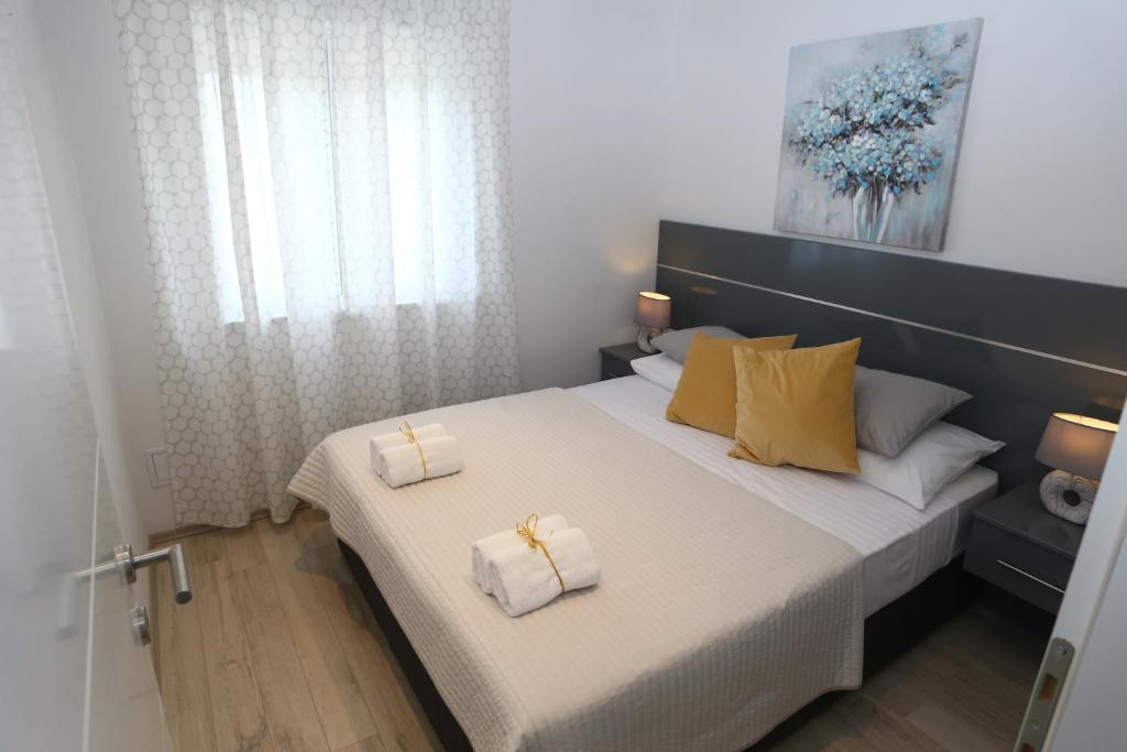 Cama o camas de una habitación en Apartment Nikolina