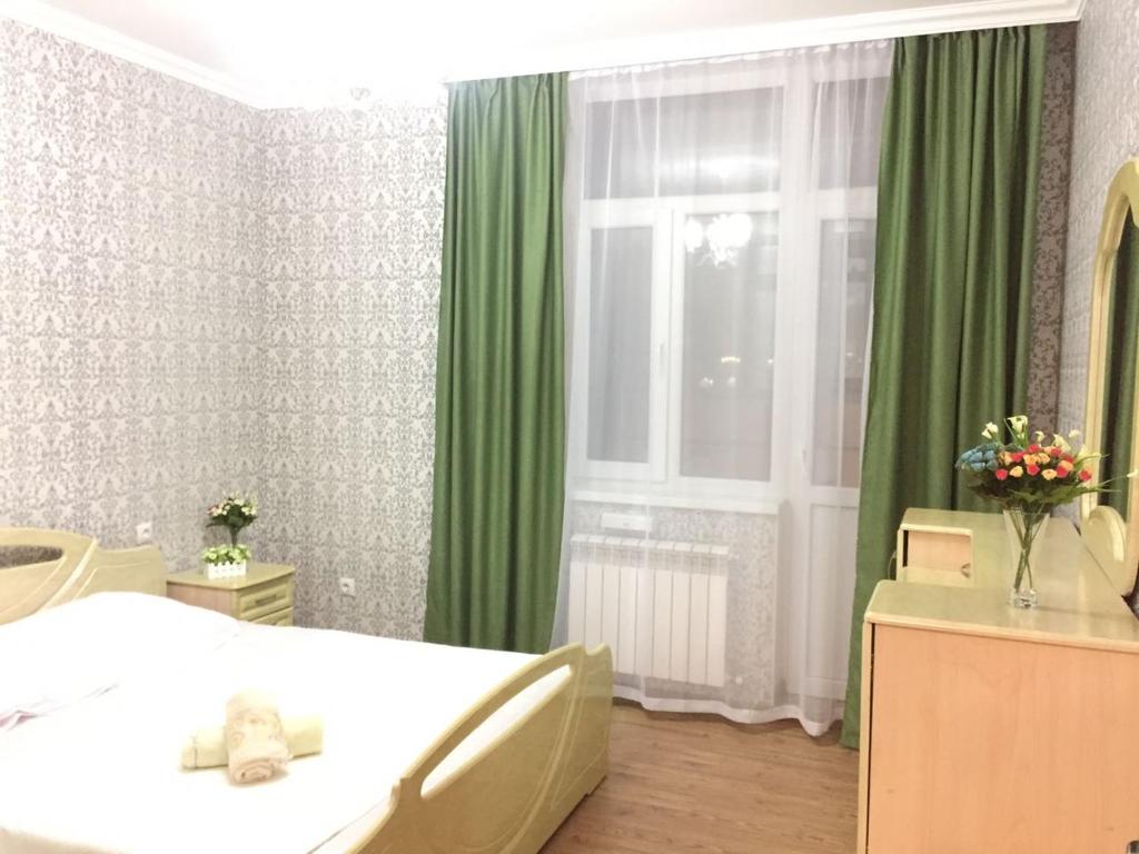 Ένα ή περισσότερα κρεβάτια σε δωμάτιο στο Apartment Mangilik Yel 51