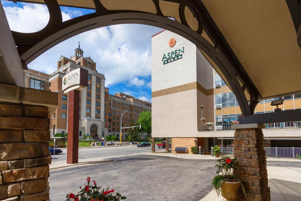 an archway over a street in a city at Aspen Suites - Rochester in Rochester