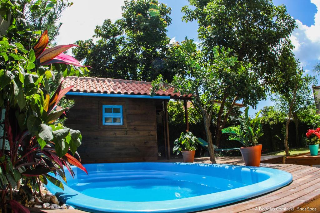 a swimming pool in front of a house at Venere - Bed and Breakfast in Florianópolis