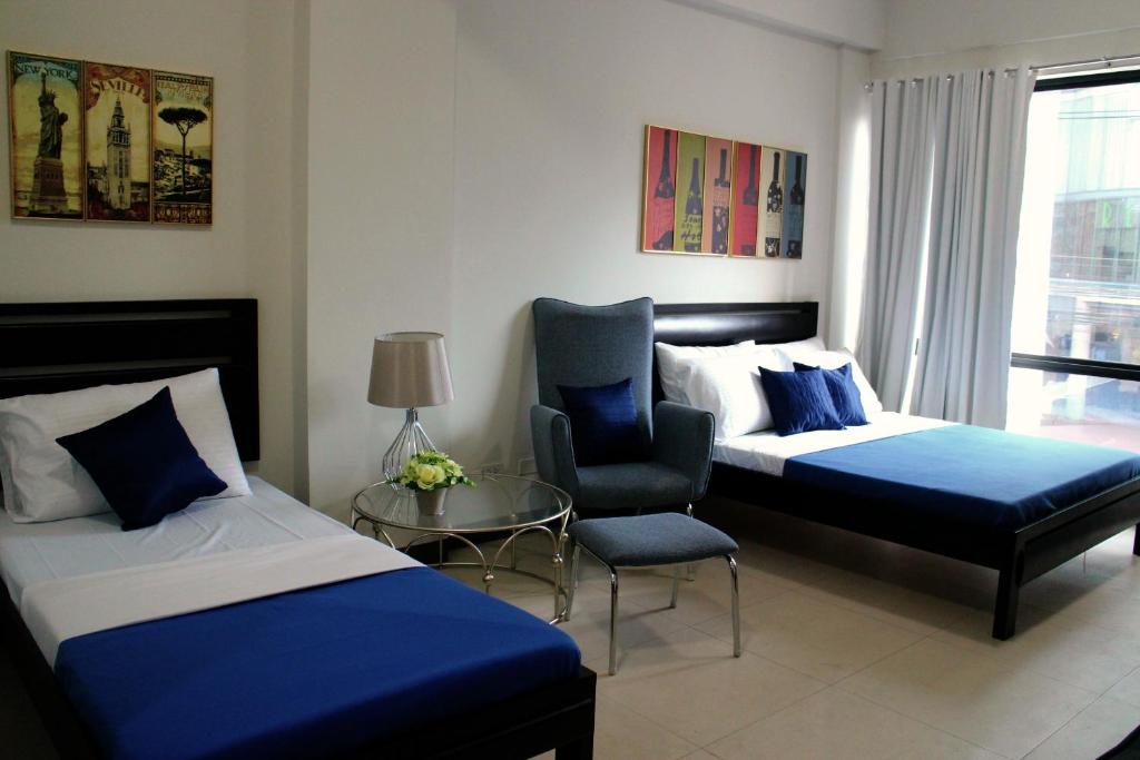 Food District Hostel - Ortigas Kapitolyo - Drievoudige Kamer