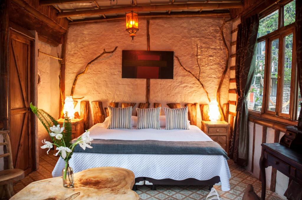 Postel nebo postele na pokoji v ubytování Casa de Piedra