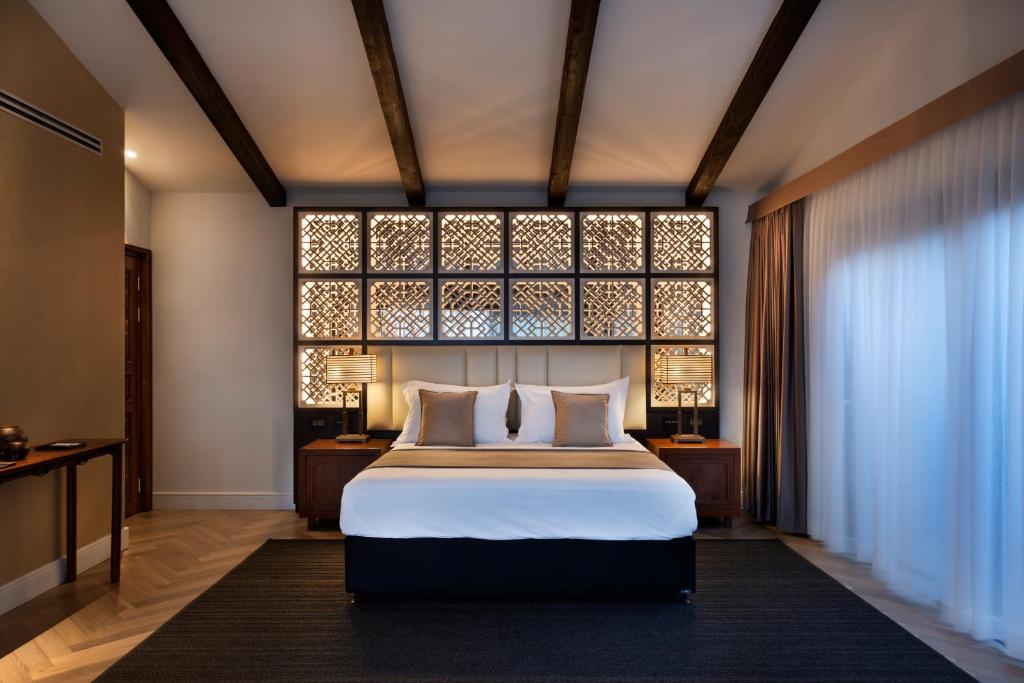 Voodi või voodid majutusasutuse Orchid Eilat Hotel toas