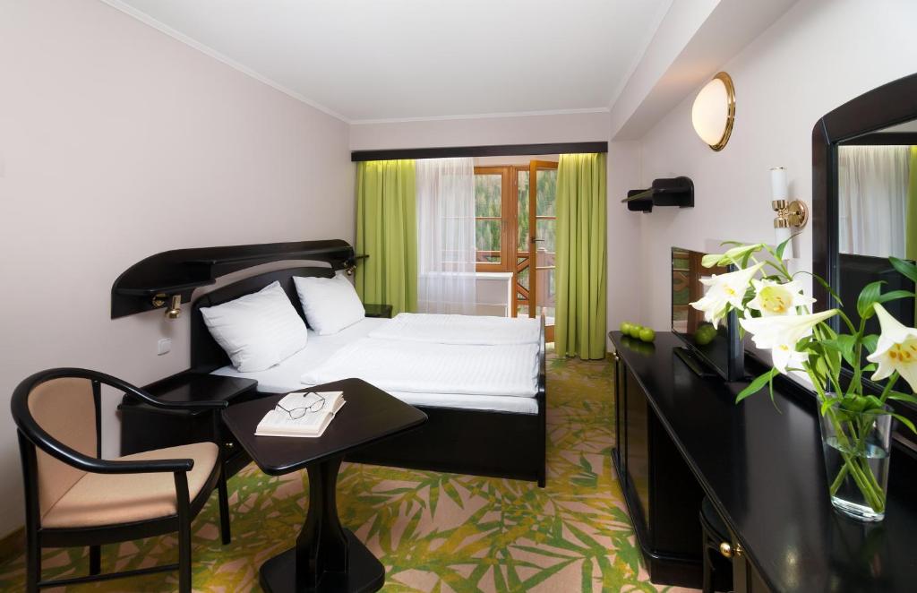 Postel nebo postele na pokoji v ubytování Hotel Zátiší