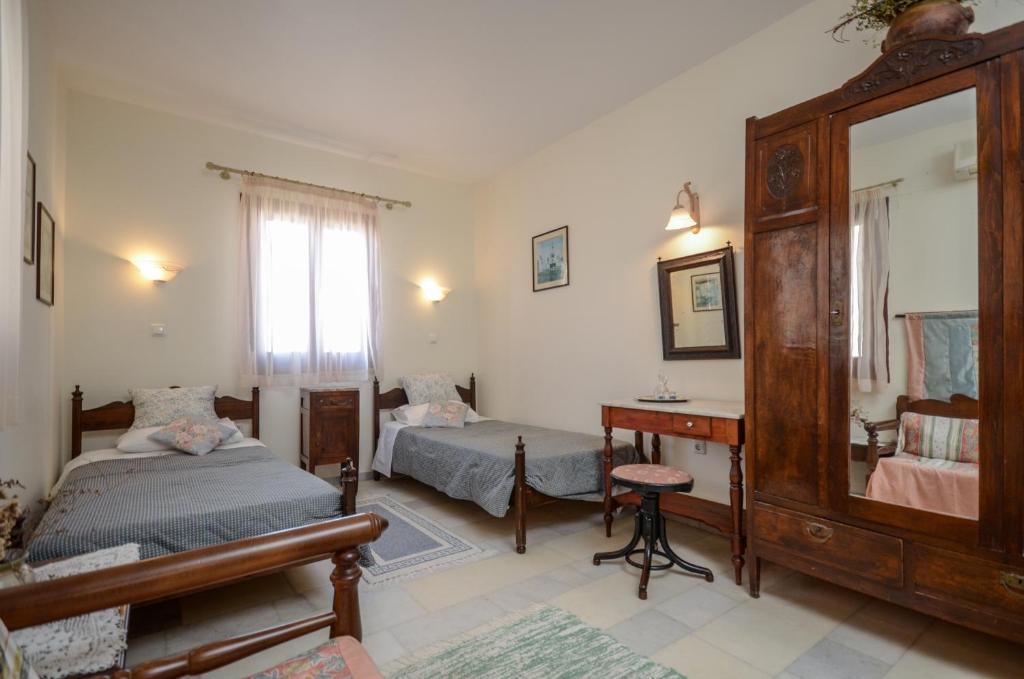Postel nebo postele na pokoji v ubytování Chateau Zevgoli