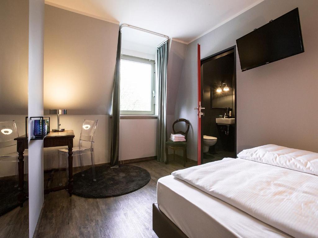 Postel nebo postele na pokoji v ubytování Hotel Heimathafen