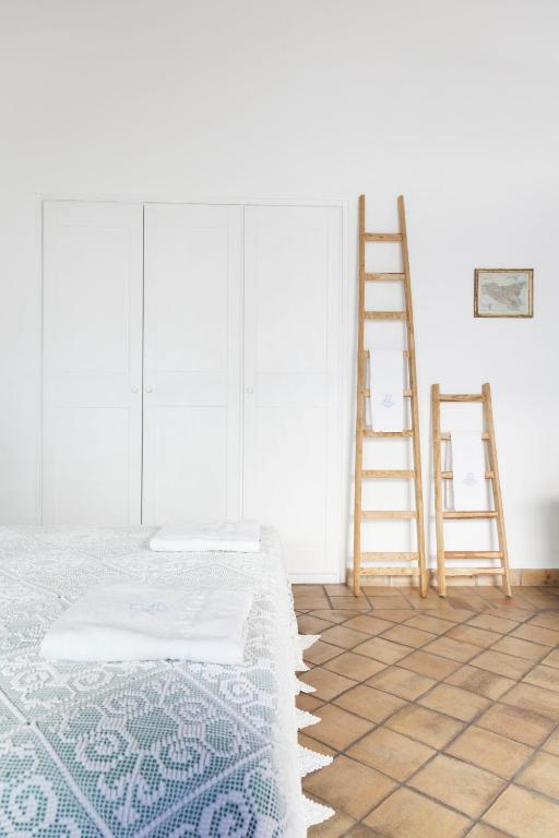 Postel nebo postele na pokoji v ubytování Hotel Mercanti di Mare