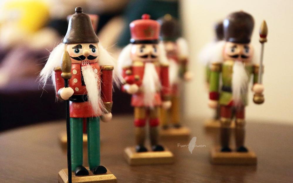 a group of miniature nutcracker figurines on a table at Redbean Guesthouse in Wujie