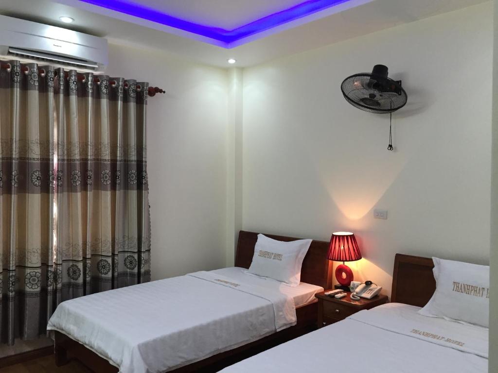 Giường trong phòng chung tại Thanh Phat Hotel