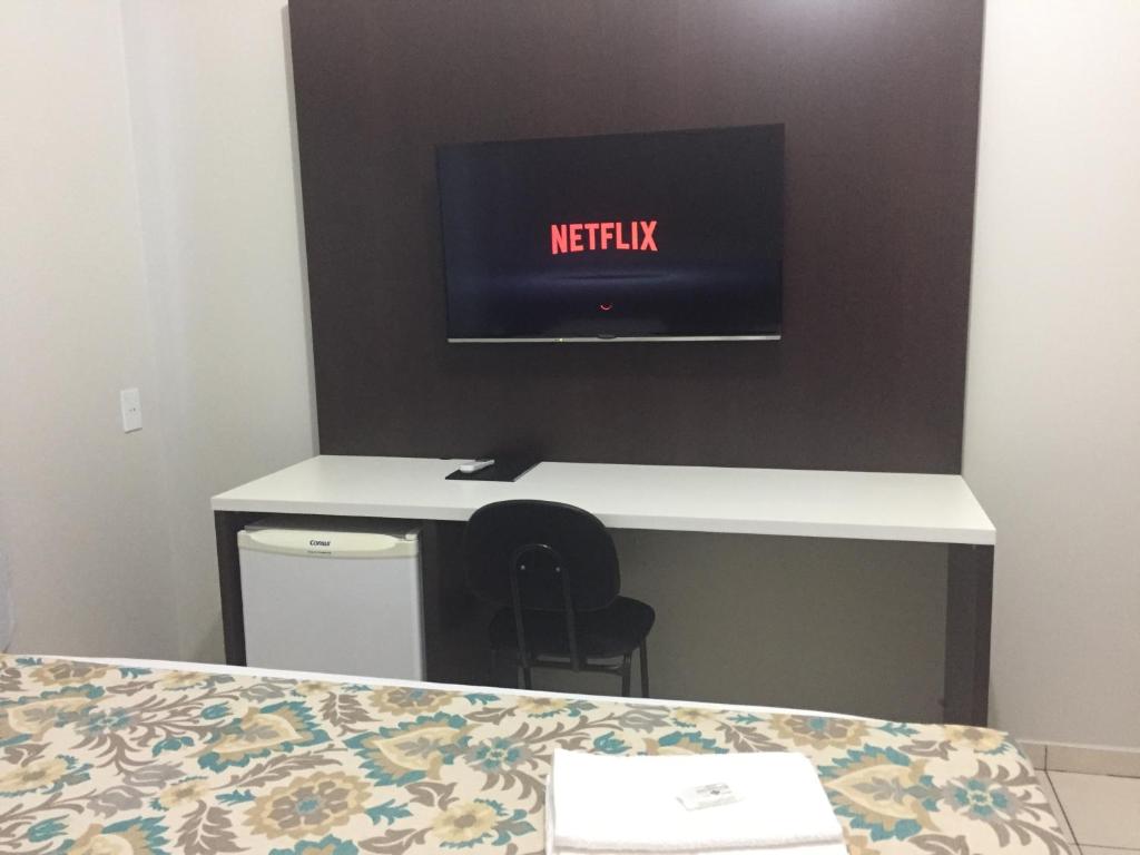 TV a/nebo společenská místnost v ubytování Hotel Notre Dame