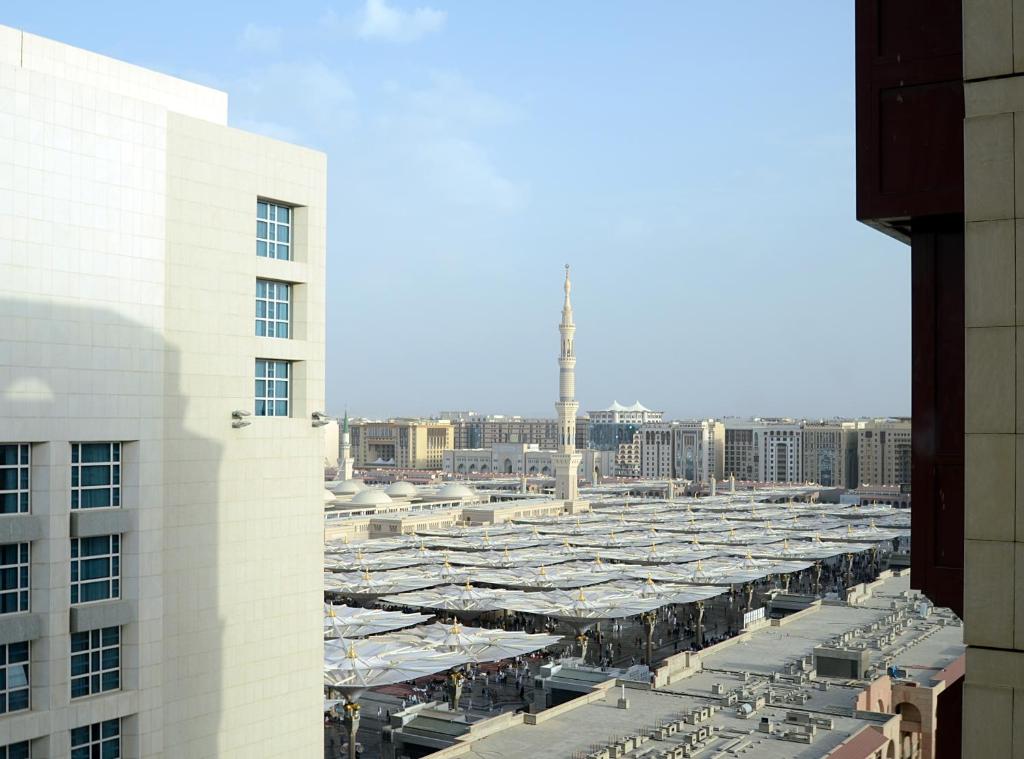 an aerial view of a parking lot in a city at فندق كونكورد دار الخير - المدينة الشمالية in Al Madinah