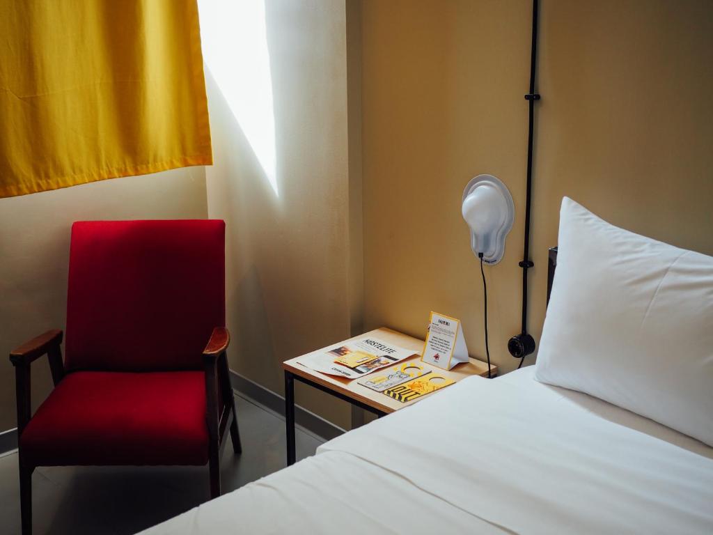 Postel nebo postele na pokoji v ubytování Fabrika Hostel & Suites