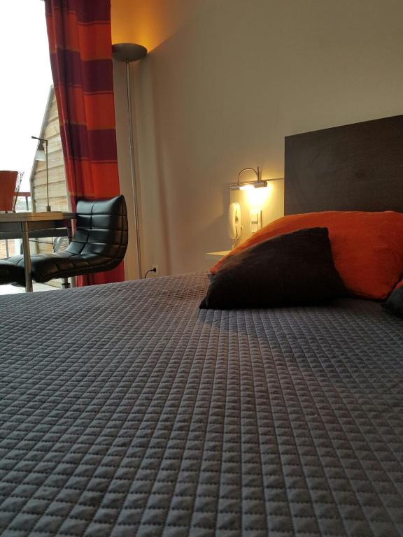 Postel nebo postele na pokoji v ubytování Hôtel Résidence Bergara
