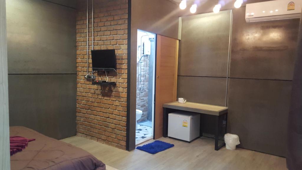 TV a/nebo společenská místnost v ubytování I-Talay Loft