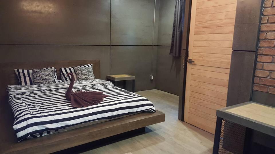 Postel nebo postele na pokoji v ubytování I-Talay Loft