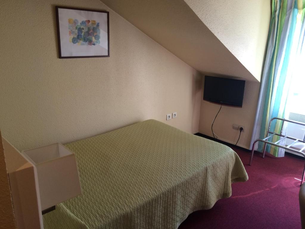 TV a/nebo společenská místnost v ubytování Hotel Elysée