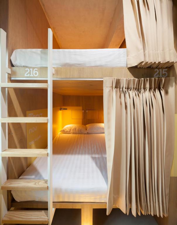 Postel nebo postele na pokoji v ubytování BoB Hostel บ็อบโฮสเทล