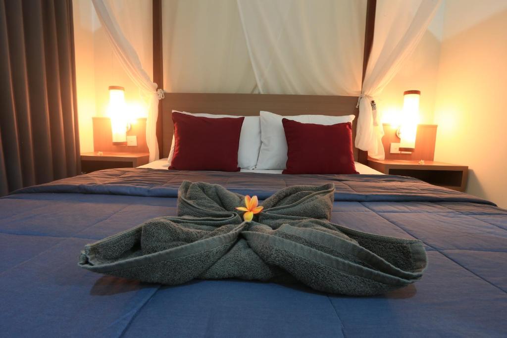 Postel nebo postele na pokoji v ubytování Gembala Homestay