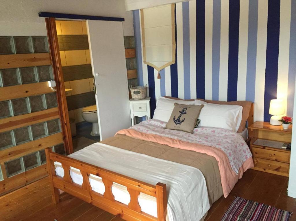 Postel nebo postele na pokoji v ubytování Water Planet Rooms