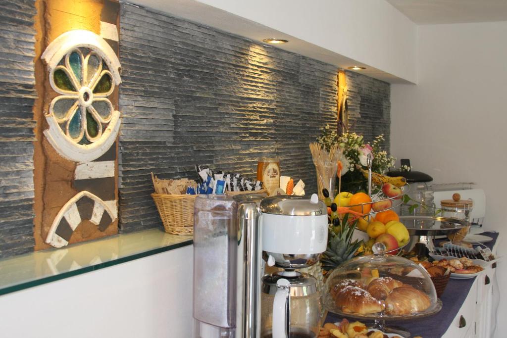 a kitchen with a counter with a coffee maker at B&B Le Giare in Monterosso al Mare