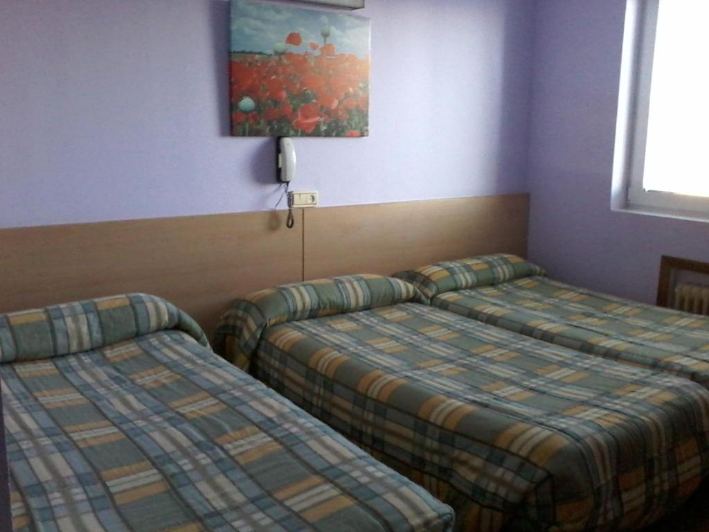 Postel nebo postele na pokoji v ubytování Hotel Buenos Aires