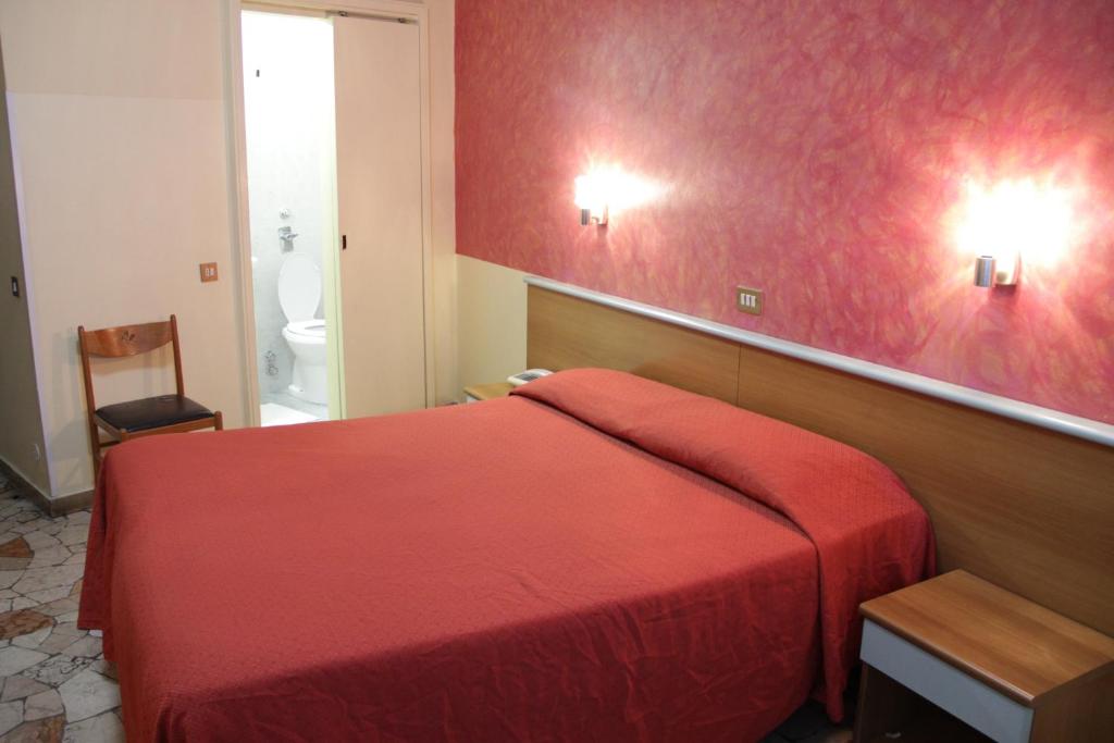 Postel nebo postele na pokoji v ubytování Hotel Del Sud
