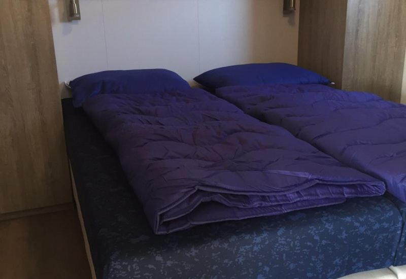 Postel nebo postele na pokoji v ubytování Camping Ginsterveld
