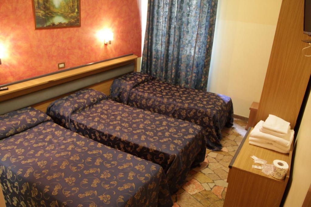 Postel nebo postele na pokoji v ubytování Hotel Del Sud