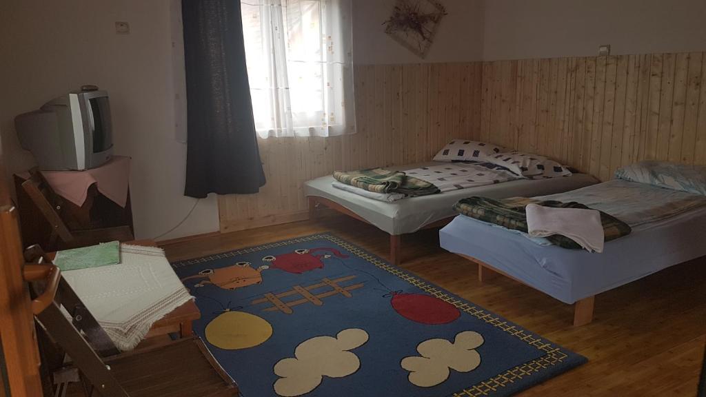 Postel nebo postele na pokoji v ubytování Pension Zamolxe