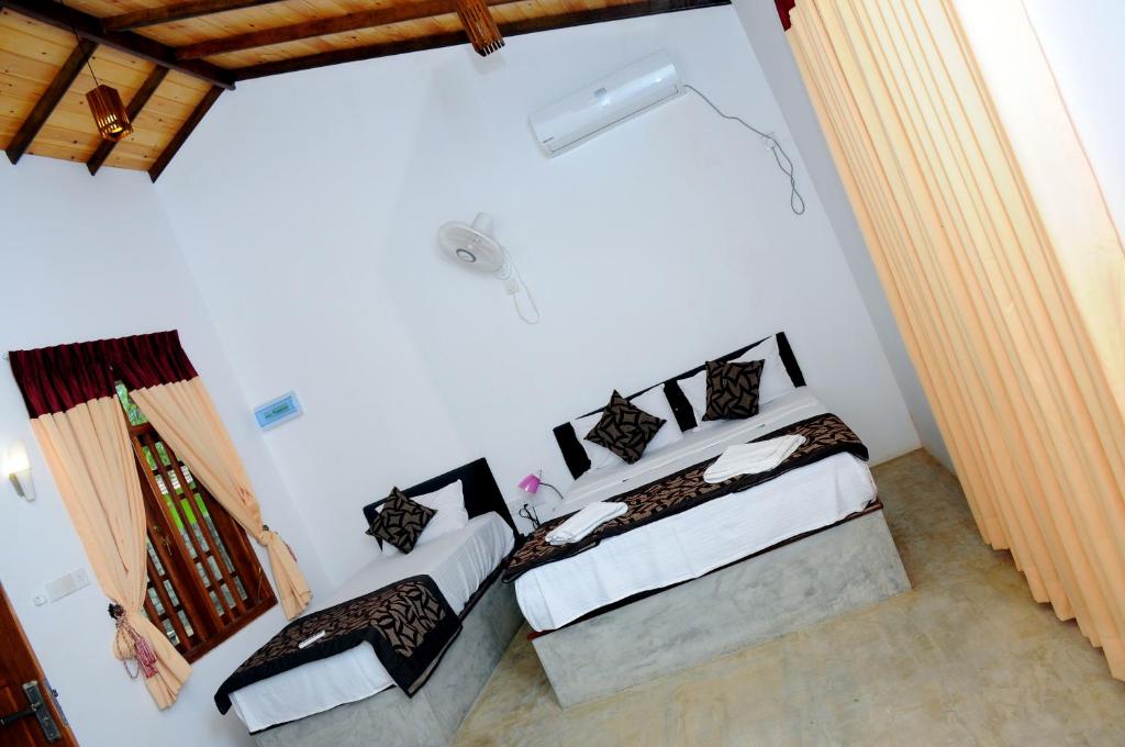 Postel nebo postele na pokoji v ubytování So-J Beach Villa