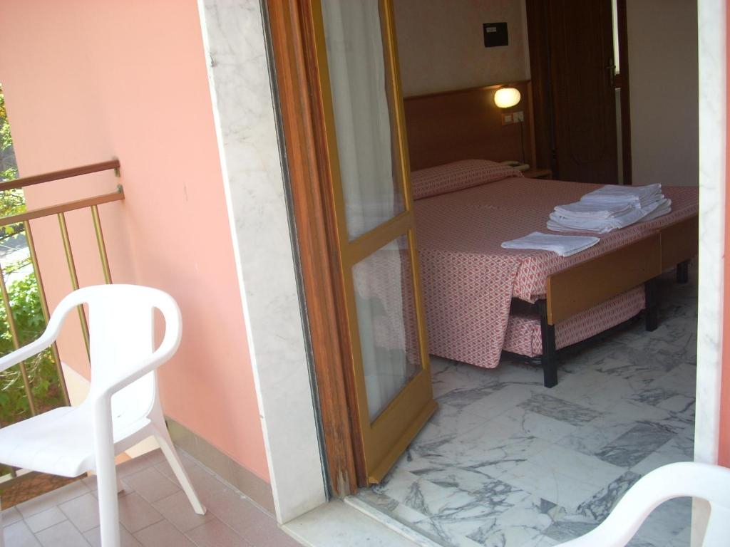 Postel nebo postele na pokoji v ubytování Hotel Corallo