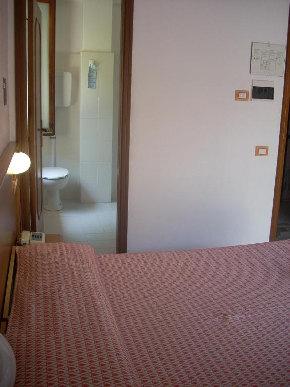 Postel nebo postele na pokoji v ubytování Hotel Corallo