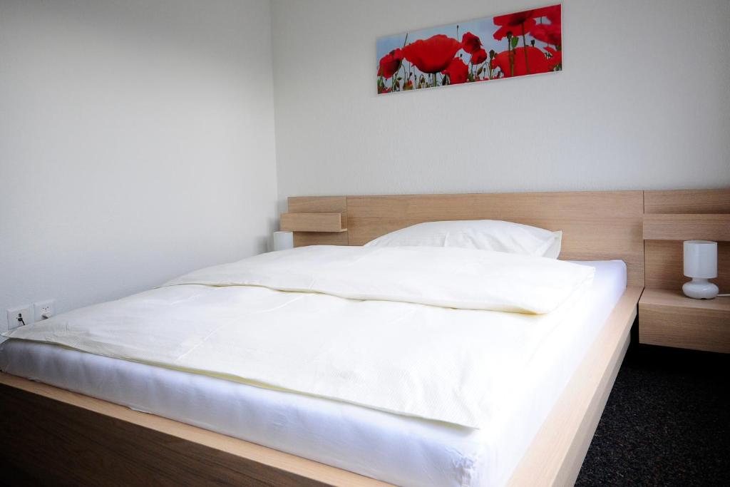 Postel nebo postele na pokoji v ubytování Hôtel Oasis