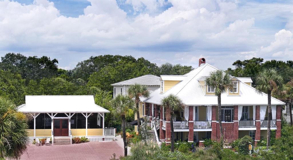 a house with a gazebo and palm trees at Beachview Inn and Spa in Tybee Island