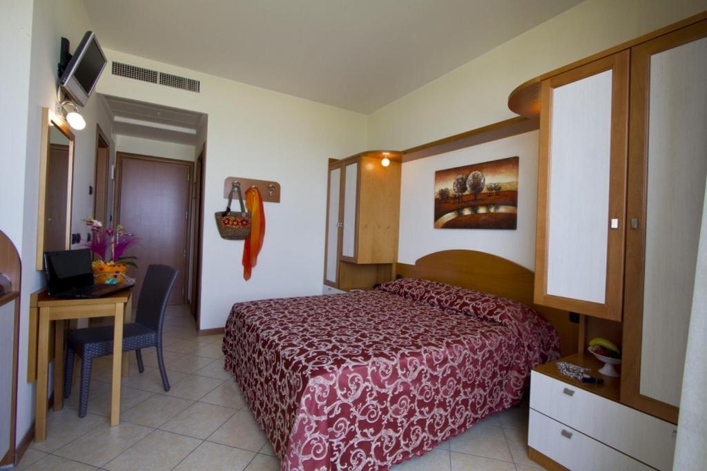 Postel nebo postele na pokoji v ubytování Hotel Palm Beach B&B SEA VIEW