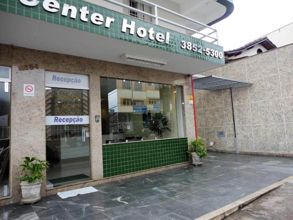 a hotel building with a sign that reads center hotel at Brasil Center Hotel in João Monlevade